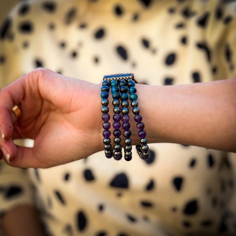 Elevate your Samsung Galaxy Watch with a stunning handmade band featuring Black Hematite, Purple Amethyst, and Blue Tiger Eye gemstones. A perfect blend of luxury and craftsmanship for the modern watch enthusiast.