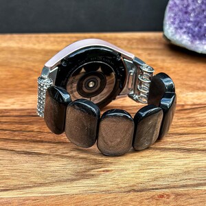 Silver Obsidian Gemstone watch band with a Samsung Galaxy Watch attached, displayed on a neutral background to emphasize the sophisticated style.