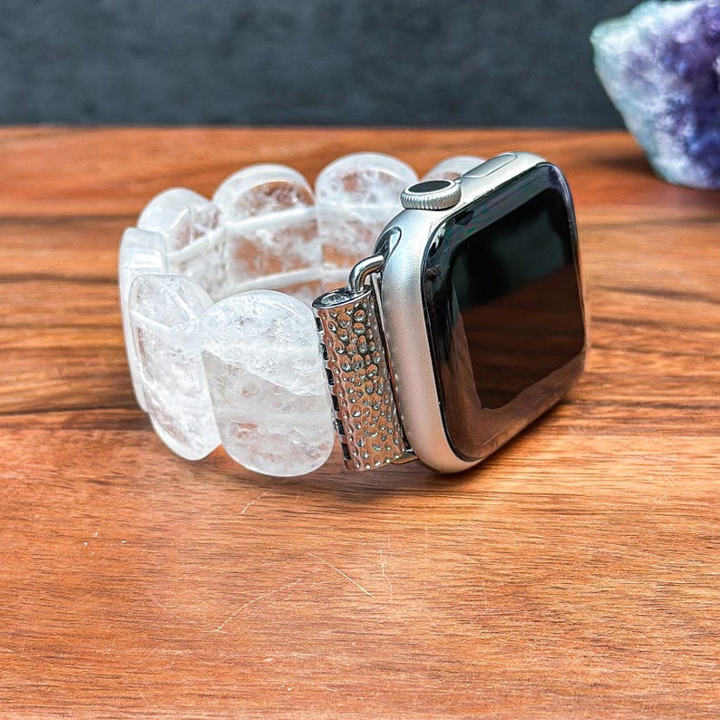 Side view of Apple Watch with elegant oval white crystal gemstone band, showcasing a clean, minimalist look.