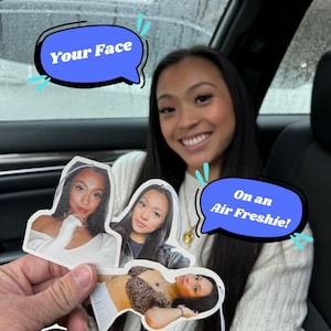 May include: Three car air fresheners with different images of women's faces. The text "Your Face" is on a blue speech bubble in the top left corner. The text "On an Air Freshie!" is on a blue speech bubble in the bottom right corner.