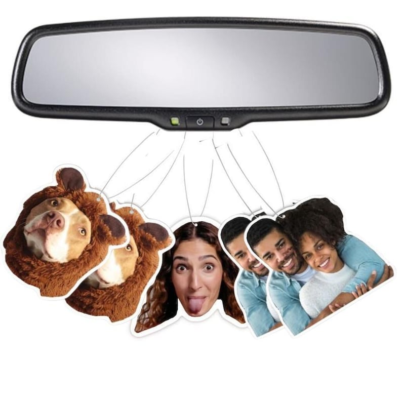 May include: A set of five car air fresheners featuring different images. One air freshener has a brown and white dog wearing a brown bear costume. Another air freshener has a woman with brown hair and a surprised expression. The other three air fresheners have images of people.