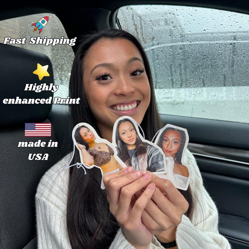 May include: Three car air fresheners featuring portraits of women. The air fresheners are white with a rounded top and bottom. The woman in the centre is wearing a brown jacket. The woman on the left is wearing a leopard print top. The woman on the right is wearing a white shirt. The text "Fast Shipping", "Highly enhanced Print", "made in USA" and a star are visible in the background.