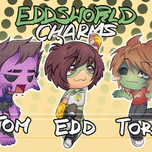 Puede incluir: Una ilustración digital titulada EDDSWORLD CHARMS que muestra tres personajes de dibujos animados etiquetados como TOM, EDD y TORD. Tom es morado con cuernos, Edd lleva una capa verde y sostiene una lata, y Tord es de piel verde.