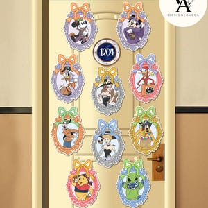 May include: A collection of colorful cartoon character stickers in ornate oval frames with bows. Characters include Mickey Mouse, Donald Duck, and others. A round sign displays the number 1204. The stickers are affixed to a beige door.