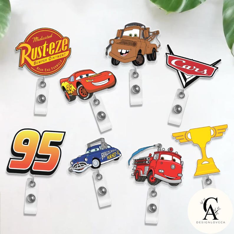 May include: A collection of cartoon character badge reels featuring designs from the movie Cars. The reels include Lightning McQueen, Mater, and the Rust-eze logo, along with other Cars-themed graphics. Each reel has a white retractable cord.