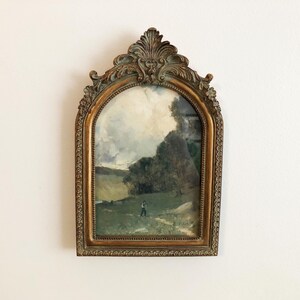 Vintage landscape art print in baroque bronze arch frame