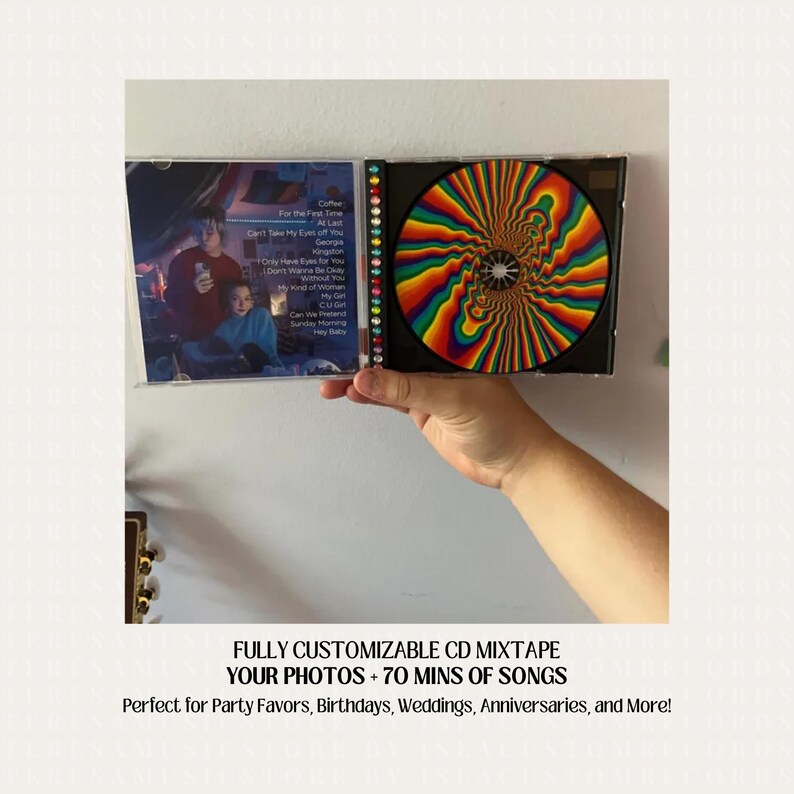 May include: A customizable CD mixtape with a rainbow swirl design on the disc. The CD case has a list of songs on the back, including "Coffee", "For the First Time", "At Last", "Georgia", "Only Have Eyes For You", "My Kind of Woman", "My Gin", "CUGH", "Can We Pretend", "Sunday Morning", and "Hey Baby". The text "FULLY CUSTOMIZABLE CD MIXTAPE YOUR PHOTOS + 70 MINS OF SONGS Perfect for Party Favors, Birthdays, Weddings, Anniversaries, and More!" is printed below the image.