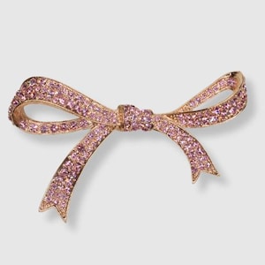 Broche vintage de lazo con diamantes de imitación rosas de KJL - MARCADO