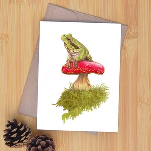Rainette sur champignon amanite.  Carte d'art originale dessinée à la main