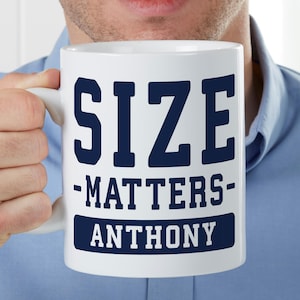 May include: White ceramic mug with a blue and white design. The mug says "SIZE MATTERS" and "ANTHONY" in a bold, blue font.