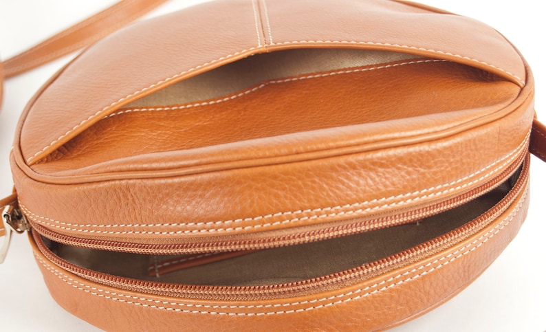 Bella round cross-body bag Canada shoulder bag in black or tan Italian leather linedfront pockethandmade in Toronto