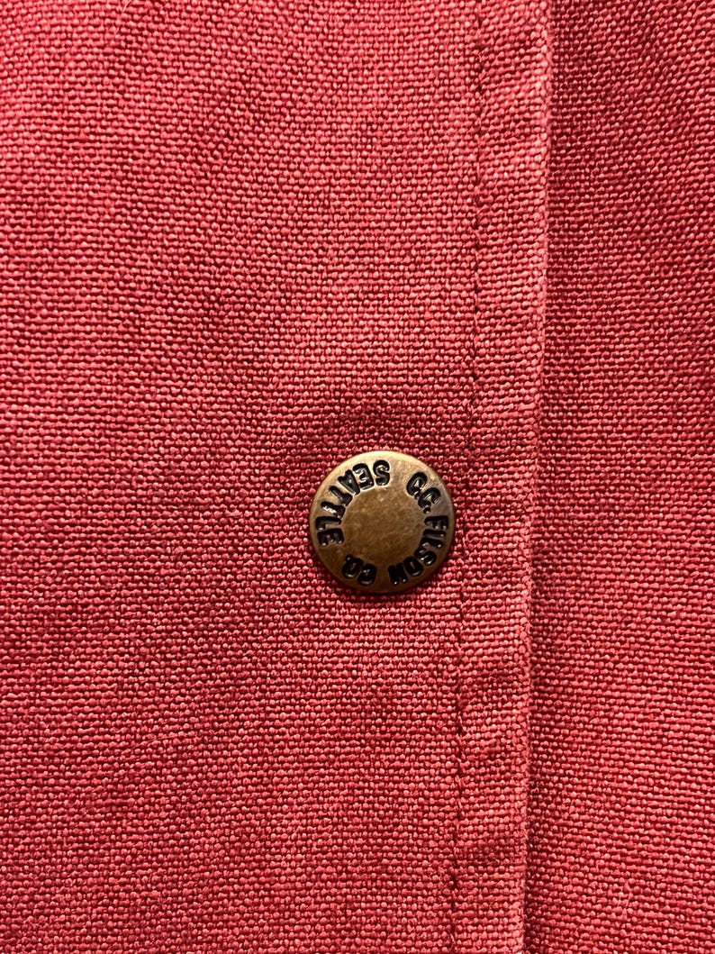 May include: A handmade wooden sign with the text "Welcome to our home" in a handwritten style. The sign is painted white with a distressed finish and a dark brown border. It measures approximately 12 inches wide and 8 inches tall.