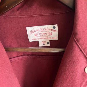 May include: A set of three ceramic mugs with a speckled, matte finish. The mugs are in shades of cream, light gray, and dark gray. Each mug has a simple, minimalist design, perfect for coffee or tea.