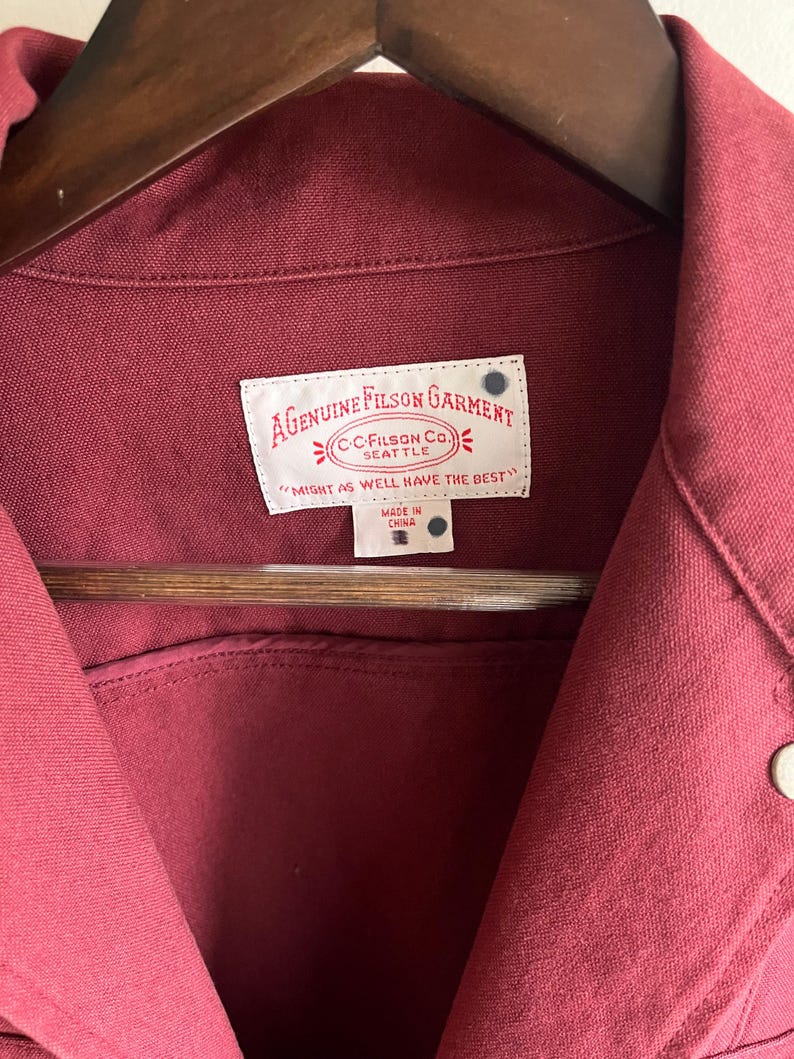 May include: A set of three ceramic mugs with a speckled, matte finish. The mugs are in shades of cream, light gray, and dark gray. Each mug has a simple, minimalist design, perfect for coffee or tea.