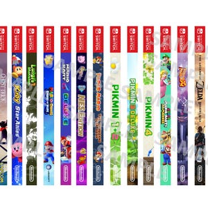 May include: A collection of Nintendo Switch game cases featuring various titles. The cases display colorful artwork and game titles such as "The Legend of Zelda", "Mario Kart Deluxe", and "Kirby Star Allies". The Nintendo Switch logo is visible.