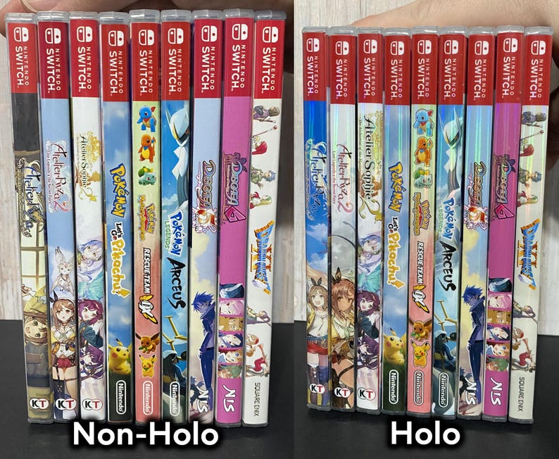 May include: A collection of Nintendo Switch game cases, featuring titles like "Atelier Ryza 2", "Pokemon", and "Dragon Quest". The cases have colorful artwork and the "Nintendo Switch" logo at the top. The image is divided into "Non-Holo" and "Holo" versions.