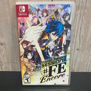 May include: A Nintendo Switch game case with a colorful anime-style illustration of characters. The game title is "Tokyo Mirage Sessions #FE Encore" with a red, white, and blue color scheme. The ESRB rating is "T for Teen".