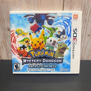 May include: A Nintendo 3DS game cartridge for "Pokémon Mystery Dungeon: Gates to Infinity." The cover features various Pokémon characters in a colorful design with the game's title. The game is rated "Everyone" by the ESRB.
