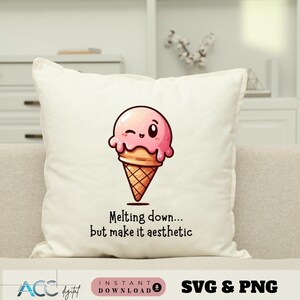 May include: A square, off-white pillow featuring a cartoon ice cream cone with a pink scoop and a waffle cone. The ice cream is winking. Below the ice cream cone is the text: "Melting down... but make it aesthetic."