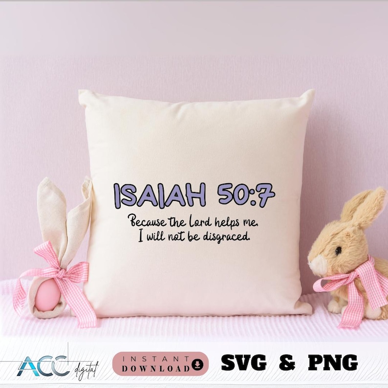May include: A white pillow with the text "ISAIAH 50:7 Because the lord helps me I will not be disgraced." printed in purple on it. The pillow is sitting on a pink surface with a stuffed bunny rabbit on the right side of the pillow.