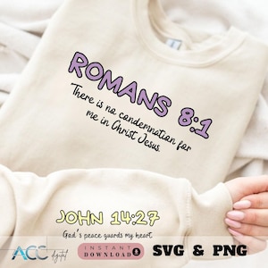 May include: A white sweatshirt with the text "ROMANS 8:1 There is no condemnation for me in Christ Jesus." and "JOHN 14:27 God's peace guards my heart." printed in purple and yellow.