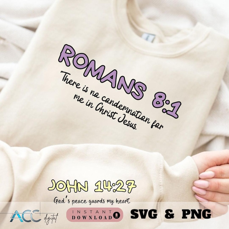 May include: A white sweatshirt with the text "ROMANS 8:1 There is no condemnation for me in Christ Jesus." and "JOHN 14:27 God's peace guards my heart." printed in purple and yellow.