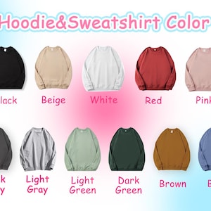 May include: A color chart showing 10 different sweatshirt colors. The colors are: black, beige, white, red, pink, dark gray, light gray, light green, dark green, brown, and blue.