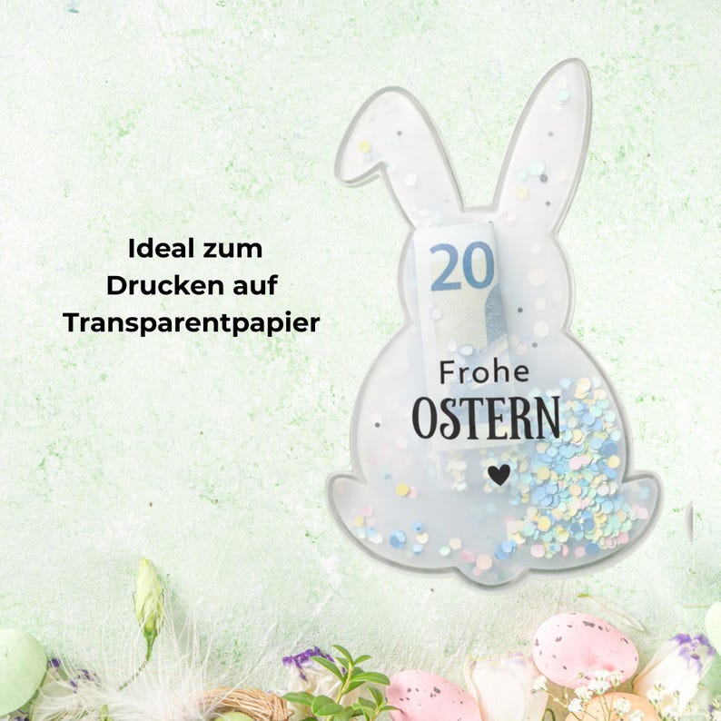May include: A clear, bunny-shaped decoration with the text "Frohe OSTERN" and a small heart. The decoration contains confetti and a rolled-up bill. The text "Ideal zum Drucken auf Transparentpapier" is also visible.