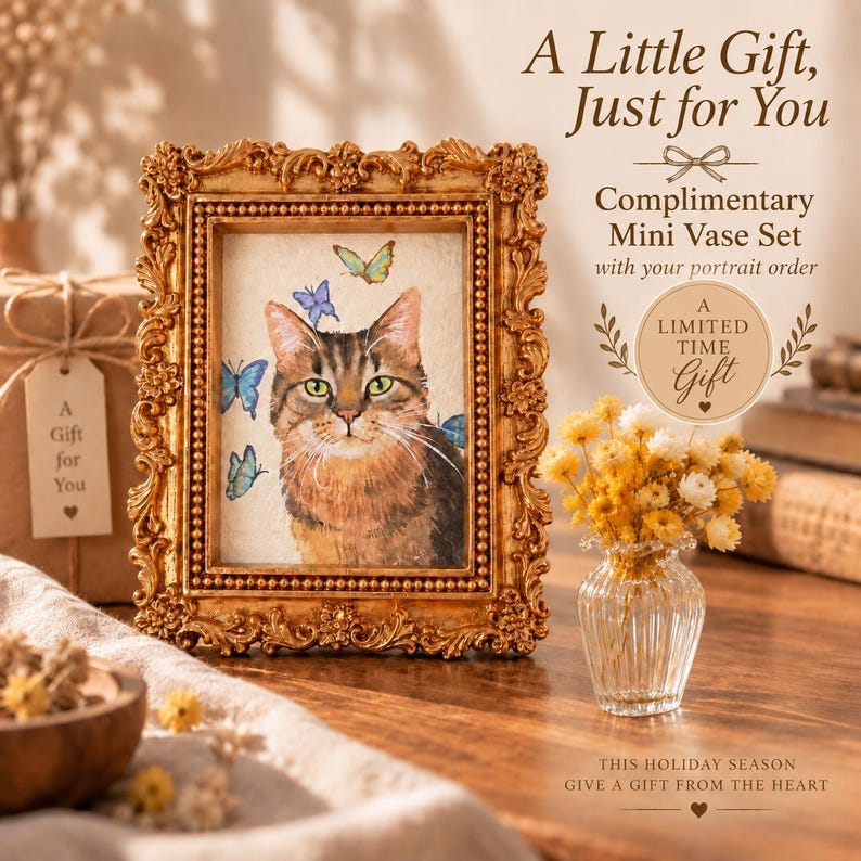 May include: A gold ornate picture frame containing a painting of a brown tabby cat with blue and green butterflies. Next to it is a small clear glass vase filled with yellow dried flowers and a circular tag reading A LIMITED TIME GIFT.