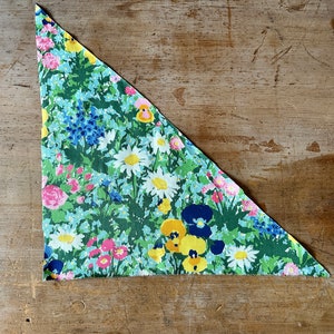 triangular fabric scrap from Bloomcraft in the 1970s with flowers and grasses