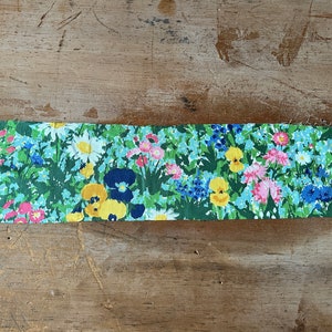 long strip of vintage fabric with flowers from the 1970s