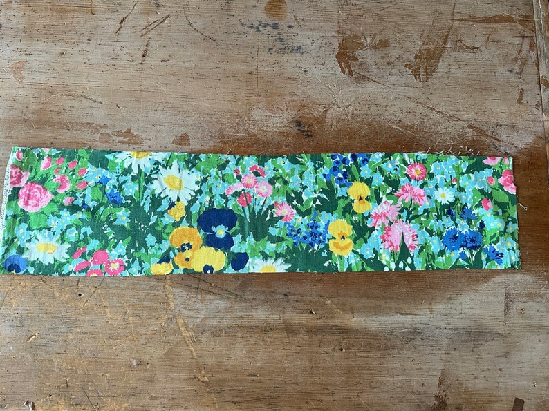 long strip of vintage fabric with flowers from the 1970s