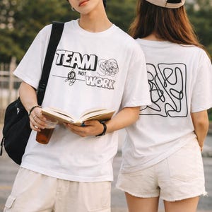 May include: A set of three ceramic mugs with a speckled, matte finish. The mugs are in shades of cream, light gray, and dark gray. Each mug has a simple, minimalist design, perfect for coffee or tea.