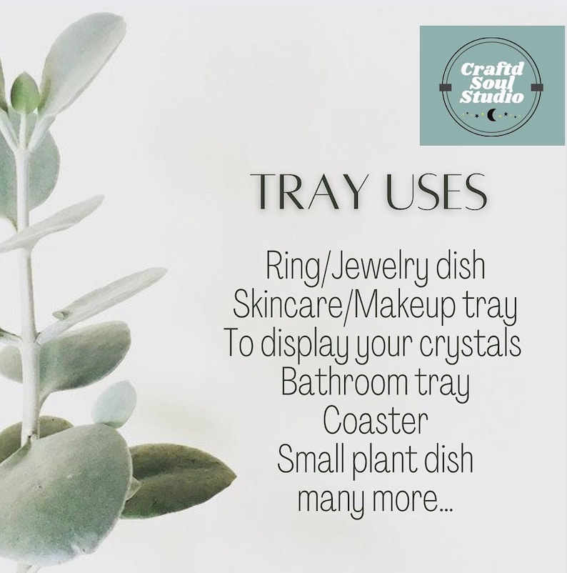 May include: A white background with a green plant on the left side of the image. The text "TRAY USES" is in black text at the top of the image. Below the text is a list of uses for a tray, including "Ring/Jewelry dish", "Skincare/Makeup tray", "To display your crystals", "Bathroom tray", "Coaster", "Small plant dish", and "many more..."
