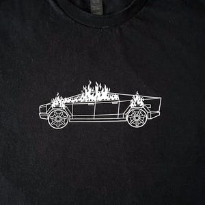 Burning cyber truck T-Shirt