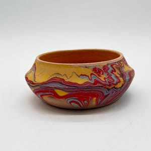 May include: A weathered wooden sign, inscribed with 'Welcome to our home' in white. The sign has a distressed appearance, suggesting a vintage aesthetic, and is suitable for a porch or hallway.