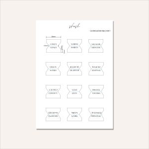 May include: A white sheet with custom section tabs for planning. The tabs are labeled with terms like "Goals," "Habits," and "Months." Each tab is approximately 20mm wide and 13mm tall. The text "skosh" is written at the top.