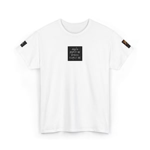 May include: White t-shirt with the text "angels protect me demons respect me" in a black square on the front. The sleeves have small decorative patches. The shirt is made of a soft, comfortable material.