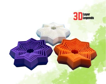 May include: Three star-shaped 3D printed objects in purple, white, and orange. Each star has a nested design, with smaller stars inside. The text "3D Layer Legends" is in the upper right corner.