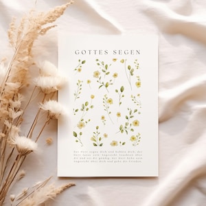 May include: A white card with the text "GOTTES SEGEN" and a floral design. The card features watercolor illustrations of yellow flowers and green leaves. The bottom of the card has a paragraph of text in German.
