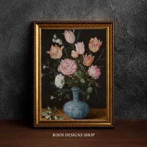 May include: A framed floral still life painting featuring a bouquet of pink and peach tulips, white flowers, and a large pink rose in a blue vase. The painting is in a gold frame. The text "ROOS DESIGNS SHOP" is at the bottom.