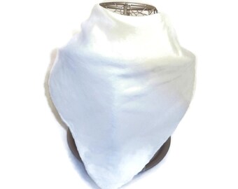 May include: A white, triangular-shaped bib made of soft fabric. The bib is folded and displayed on a stand.