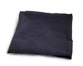 May include: A dark blue fabric folded in half. The fabric is smooth and has a slight sheen.