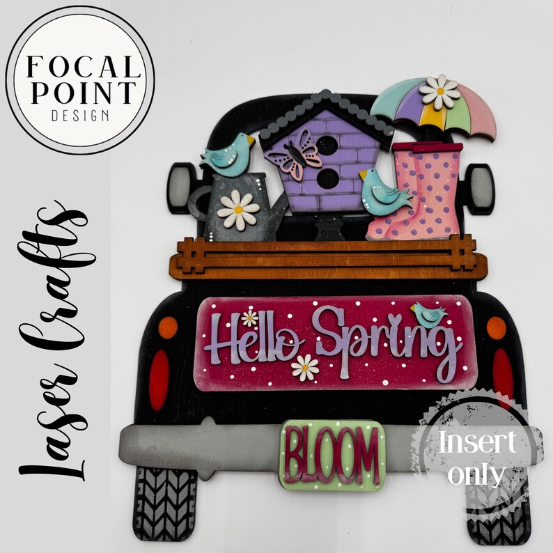 May include: A wooden truck decoration with a spring theme. It features a birdhouse, watering can, umbrella, and wellington boots. The truck bed says "Hello Spring" and "Bloom". The design includes birds, a butterfly, and flowers.