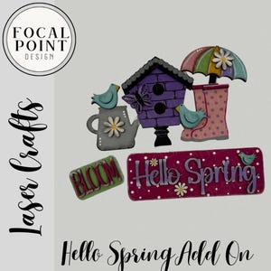 May include: Laser-cut wooden spring decorations. Includes a purple birdhouse, watering can, umbrella, rain boots, and signs that say "Bloom" and "Hello Spring." The decorations are painted in pastel colours.