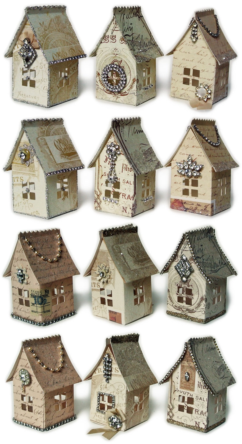 Puede incluir: Doce casas de papel en miniatura decoradas con diamantes de imitaci&oacute;n, purpurina y papel vintage. Cada casa tiene un dise&ntilde;o &uacute;nico y presenta una direcci&oacute;n y un nombre de calle diferentes.