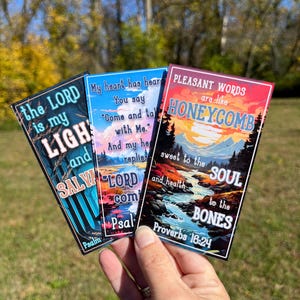 May include: Three rectangular stickers with inspirational quotes. One has the text "the LORD is my LIGHT and SALVATION". Another says "My heart has heard You say". The third reads "PLEASANT WORDS are like HONEYCOMB".