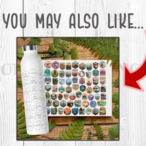May include: A white stainless steel water bottle with a black and white design featuring the names of various national parks. The bottle is sitting on a wooden surface with a sheet of stickers featuring national park logos.