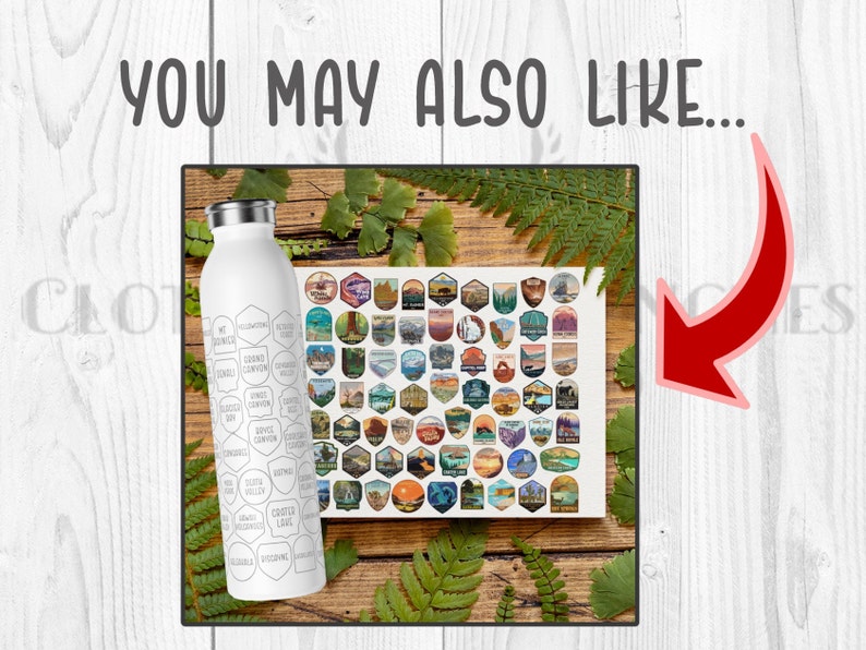 May include: A white stainless steel water bottle with a black and white design featuring the names of various national parks. The bottle is sitting on a wooden surface with a sheet of stickers featuring national park logos.