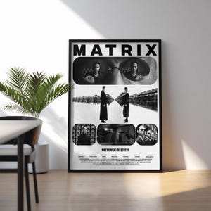 May include: A black and white poster with the title "MATRIX" in bold, white lettering. The poster features a collage of images from the film, including a close-up of Neo's face, a scene with Neo and Agent Smith, and a group shot of the cast. The poster also includes the names of the Wachowski Brothers and the film's crew.